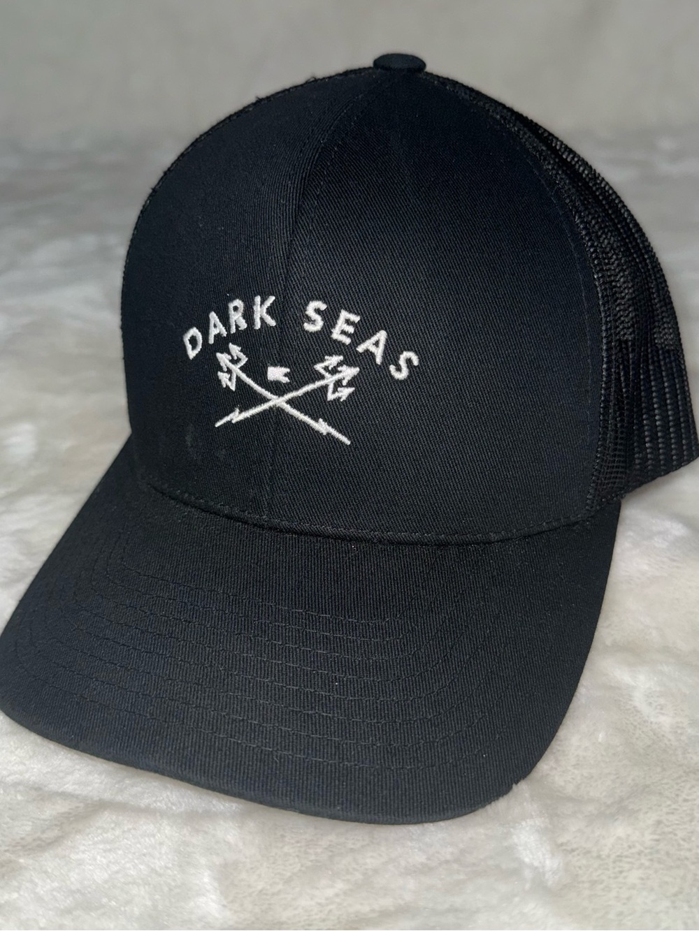 Dark Seas Men’s Black Trucker Cap with Embroidered Logo